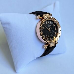 Elegant Gold and Black Watch with Crystal Details